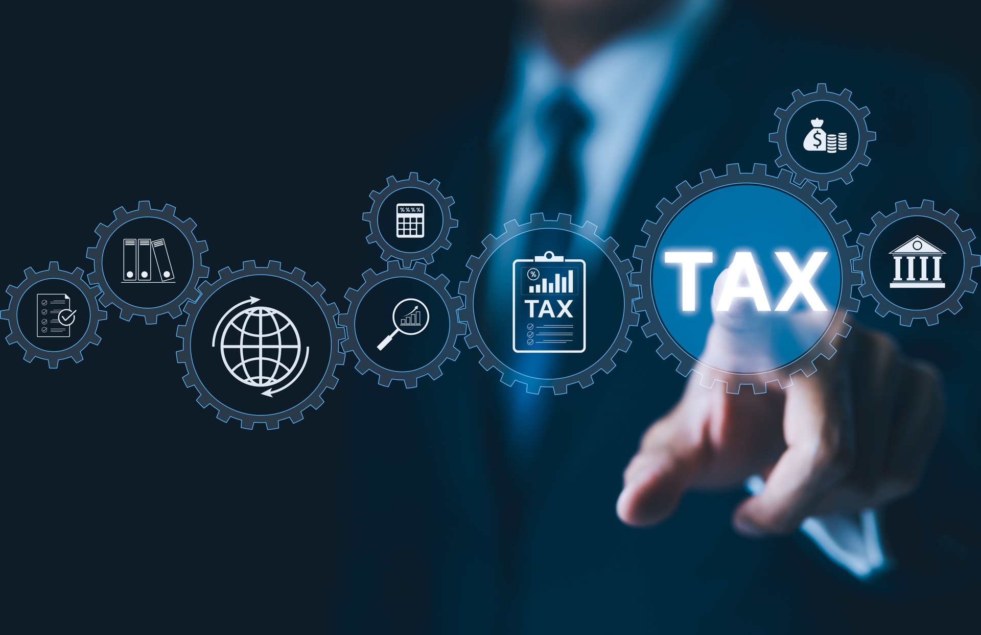 Tax Management Concept. Businessman interact with digital gears representing various tax and financial icons, modern tax management and government regulations in digital economy. Income tax, Taxation,